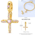 Gold-tone charm with cross shape and pink and clear gemstone accents