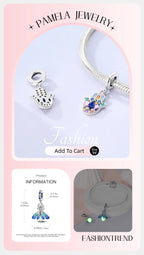 925 sterling silver charm bead with blue enamel eye and floral detail on bracelet