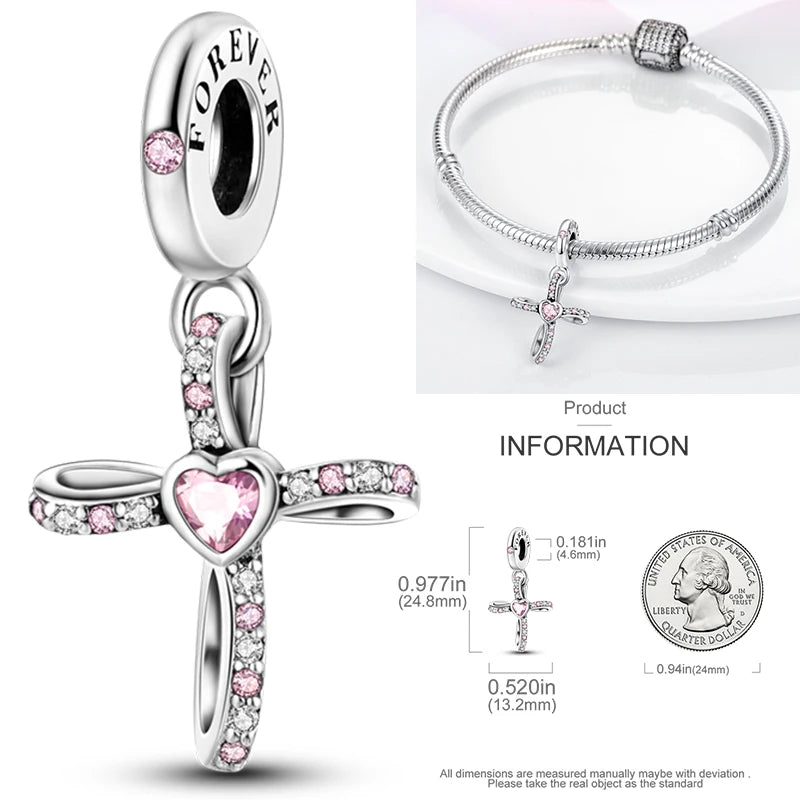 Sterling silver cross charm with heart cutout and pink crystal stones