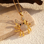 Rhinestone crab pendant necklace with gold-tone chain and sparkling studded crab charm