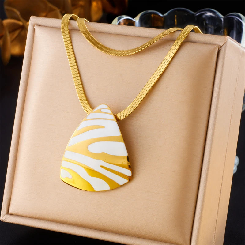 Tiger stripe teardrop pendant necklace, white enamel with gold-tone chain and black stripes