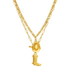 Gold-tone oval cowboy hat pendant with boot charm on layered chains