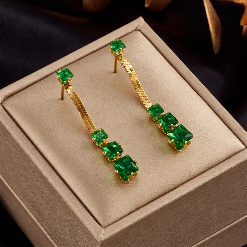 Gold-tone drop earrings with green square-stone fringe and stud posts