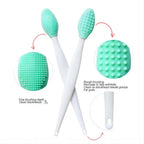 Green silicone facial cleansing brush with white handle and dot bristle head