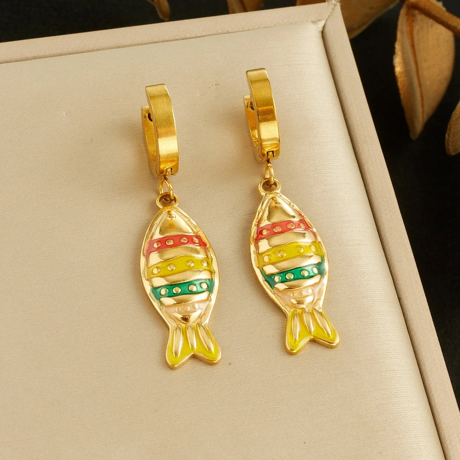 Fish enamel huggie hoop earrings, gold-tone with striped red and green fish charms