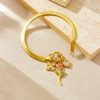 Gold-tone snake chain necklace with rose flower pendant and red enamel accents