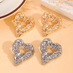Heart-shaped drop earrings with raised texture in gold and silver, pair