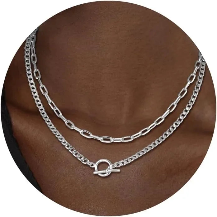 Layered silver-tone chain necklace with Cuban link and paperclip links, oval clasp