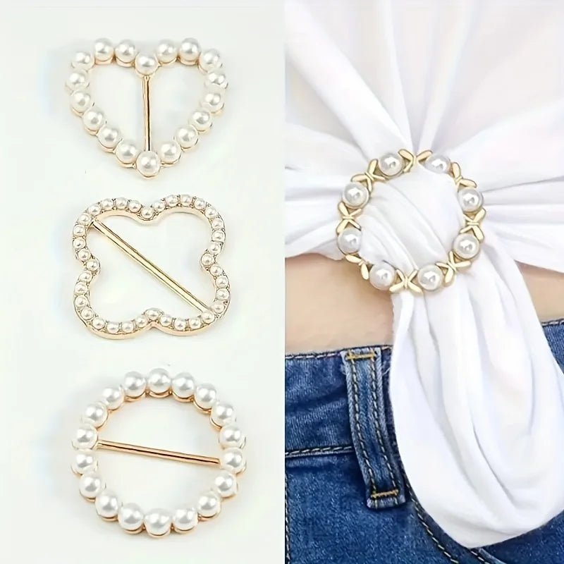 Scarf brooch clip set: pearl circle and heart-shaped rhinestone clips on white fabric