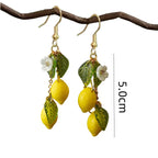 Lemon and leaf charm drop earrings in gold-tone with yellow lemons and white blossoms