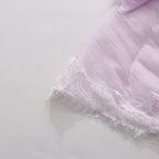 Lavender lace and ruffle trim detail on a tiered maxi slip dress