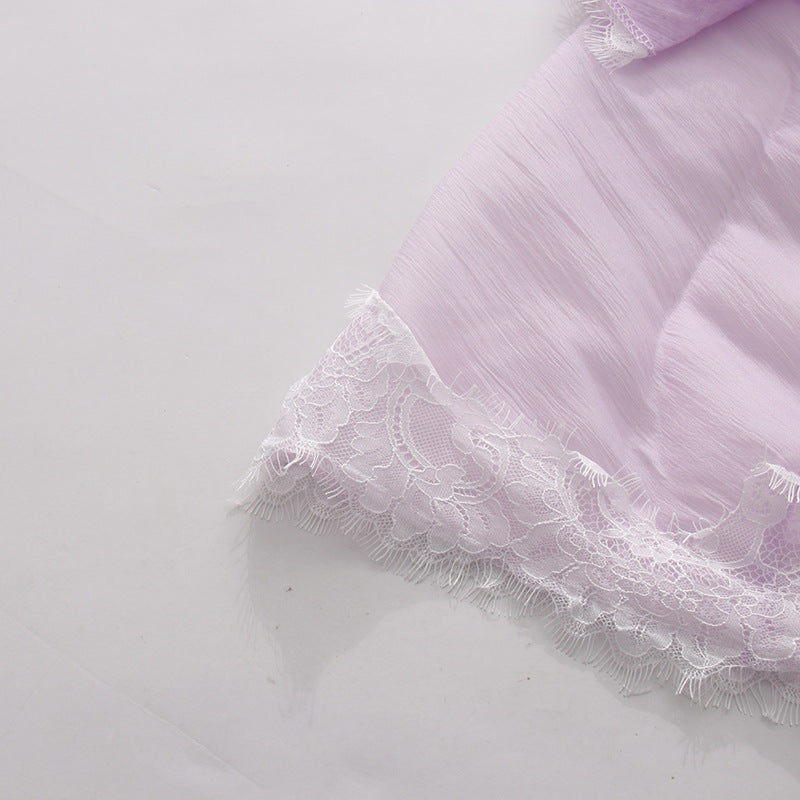 Lavender lace and ruffle trim detail on a tiered maxi slip dress