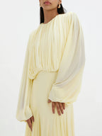 Cream pleated maxi dress with long balloon sleeves and gathered front yoke