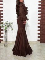 Ruffled dark brown blouse and sheer mermaid maxi skirt set, angled side view
