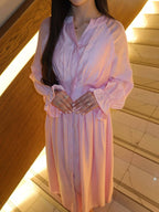 Pastel pink puff-sleeve button flowy dress with V-neck and ruched waist