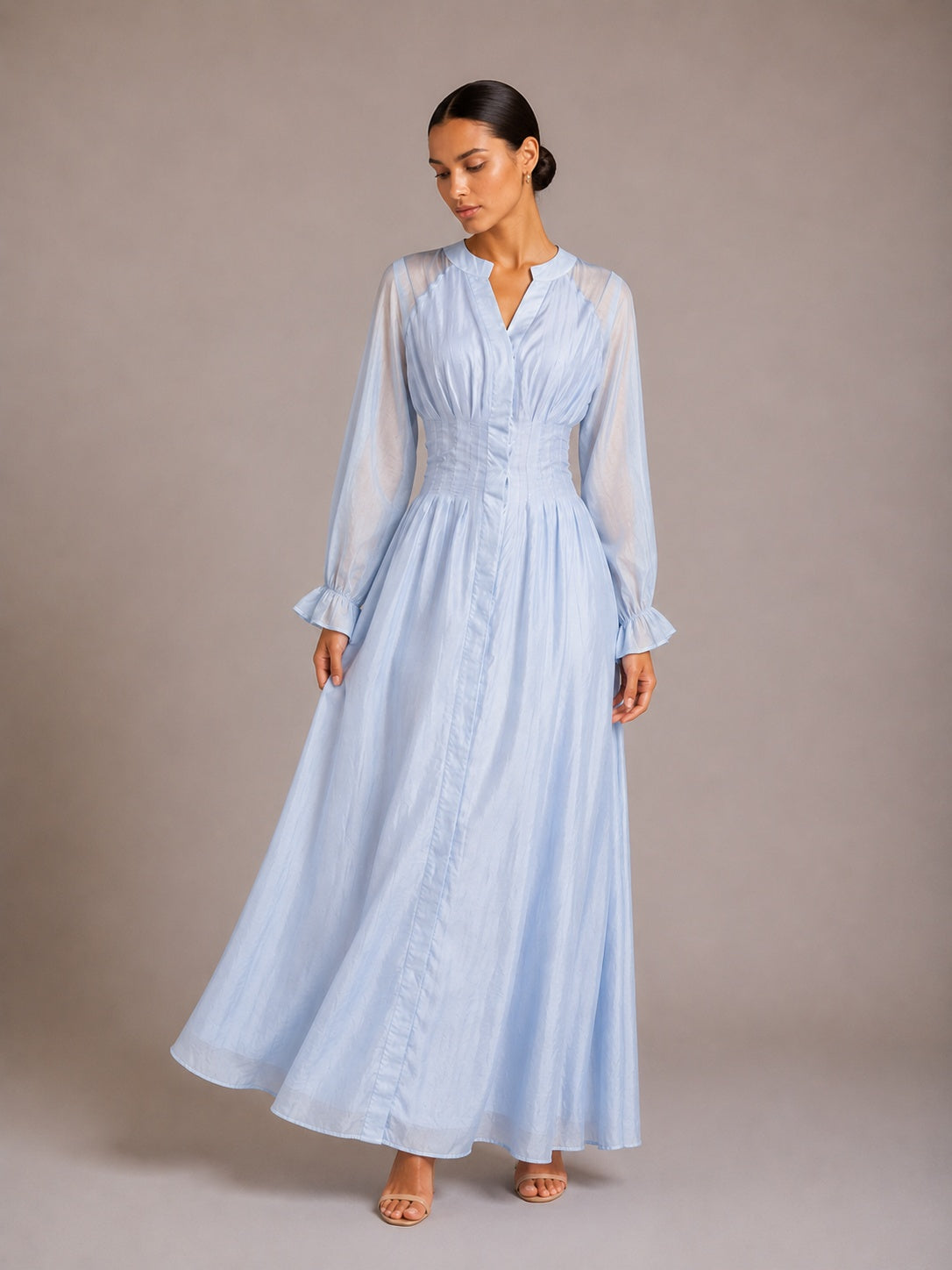 Light blue puff-sleeve button flowy dress with V-neck and gathered waist