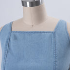 Light blue denim off-shoulder square neckline dress with visible seam and structured bodice