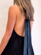Black pleated halter maxi dress with open back