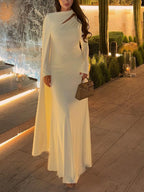 Light apricot long-sleeve maxi dress with wrap-style draped neckline and full-length skirt