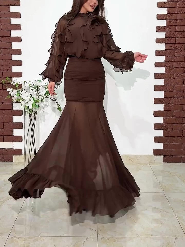 Ruffled dark brown blouse and sheer mermaid maxi skirt set, side profile