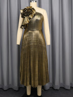 Gold one-shoulder pleated midi dress on mannequin with floral applique at shoulder