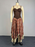 Brown corset top and plaid asymmetrical skirt set on mannequin, corset lacing seams